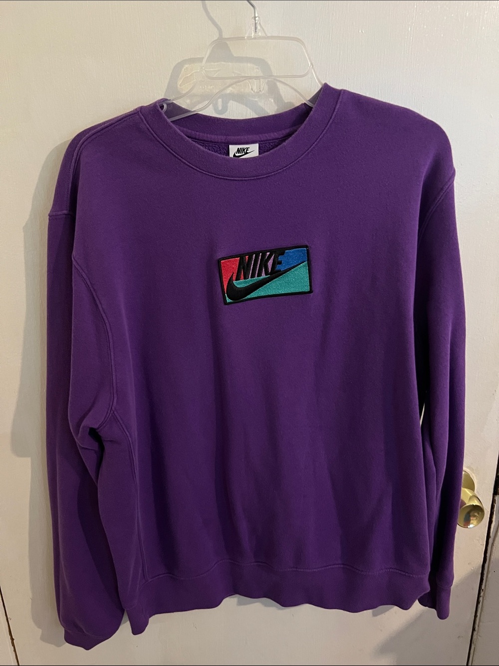 Nike Women’s Purple Crewneck Sweatshirt with Colorblock Logo Patch